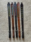 Brown leather rifle sling with black panels, gold “SPRINGFIELD,” and “SAVAGE” text.