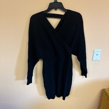Black mini sweater dress with cross back detail