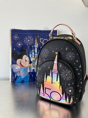 disney peter pan second star glow mini backpack Loungefly You Can Fly It features the iconic scene of Peter and Tinker Bell guiding the Darling children to Neverland by flying towards the second star to the right and straight on till morning Loungefly Disney Peter Pan Second