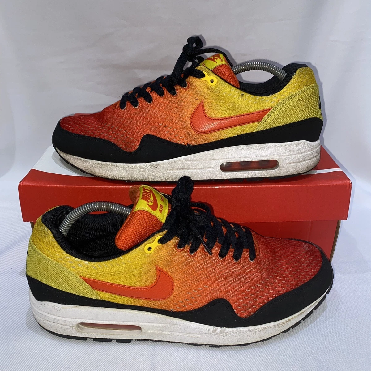 Orange yellow deals and black nikes