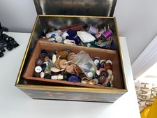 Vintage oriental tin filled with buttons