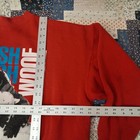 Red vintage sweatshirt XL with “WOOF” in blue, surrounded by white dog head graphics and USA Made label.