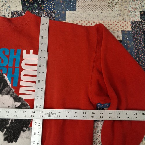 Red vintage sweatshirt XL with “WOOF” in blue, surrounded by white dog head graphics and USA Made label.