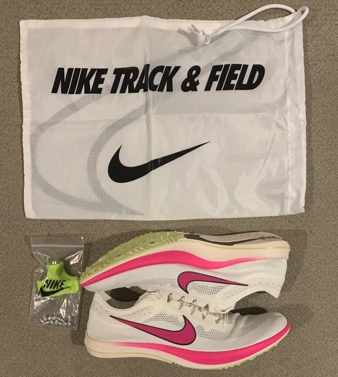 Nike off deals white track spikes