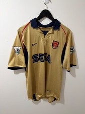 Preços baixos em Nike Arsenal Gold International Club fã de