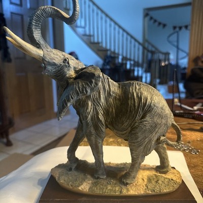 Bull Elephant Sculpture. 10 Inches Tall. Made Of Resin And On A Wood Platform.