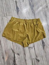 Calia by Carrie Underwood Woman’s Running Shorts Size XL Mustard Yellow