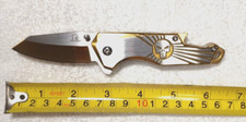SPRING ASSISTED KNIFE GOLD AND SILVER BOTTLE OPENER GLASS BREAK PUNISHER 6.2"