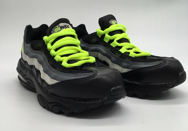 neon green and gray nike shoes