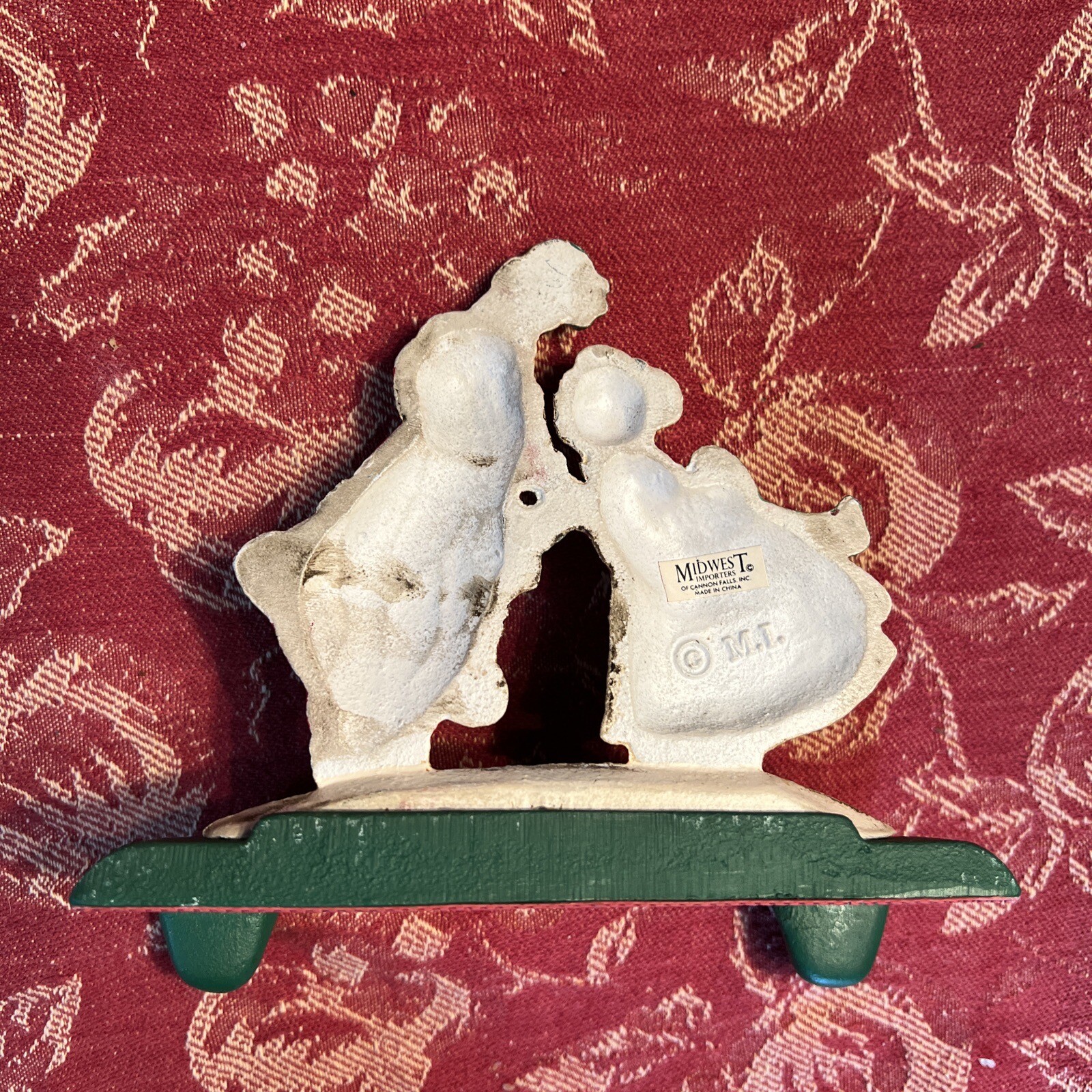 VTG MIDWEST CAST IRON DOUBLE STOCKING HOLDER MR & MRS CLAUS KISSING