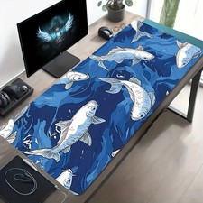 A Large Electronic Sports Gaming Mouse Pad Featuring a Blue And White Koi Fish