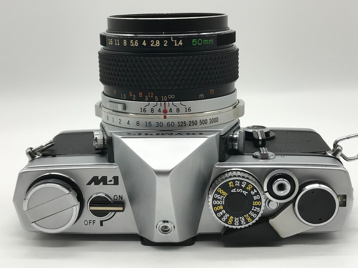 OLYMPUS M-1 SLR 35mm Film Camera + G.ZUIKO AUTO-S 50mm f/1.4 OLYMPUS M-1 SLR 35mm Film Camera + G.ZUIKO AUTO-S 50mm f/1.4