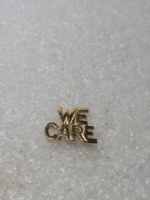 Vintage ''WE CARE'' Gold Tone Pin Brooch Single Post Lift Back Script Block Letter