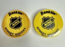 2 Franklin NHL Street Hockey Pucks Yellow - Used