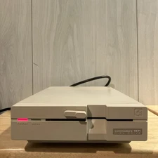 Commodore 1571  5 1/4" Floppy Disk Drive Powers On UNTESTED For Parts or Repair