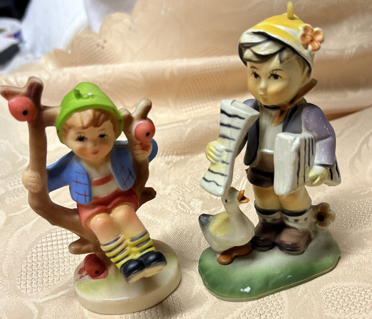 Lot Of 2 Hummel Like' Plastic, Boy In Tree And A Boy With Goose MadeIn Hong Kong