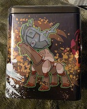 pokmon trading card game: stacking tin- treasures Pokemon - TCG 3 Pokemon TCG booster packs 2 Pokemon sticker sheets featuring Ogerpon and its masks Stackable tin for display and storage A unique addition for fans of Kitakami lore and legendary Pokemon design. Treasures Of Ruin Stacking Tin