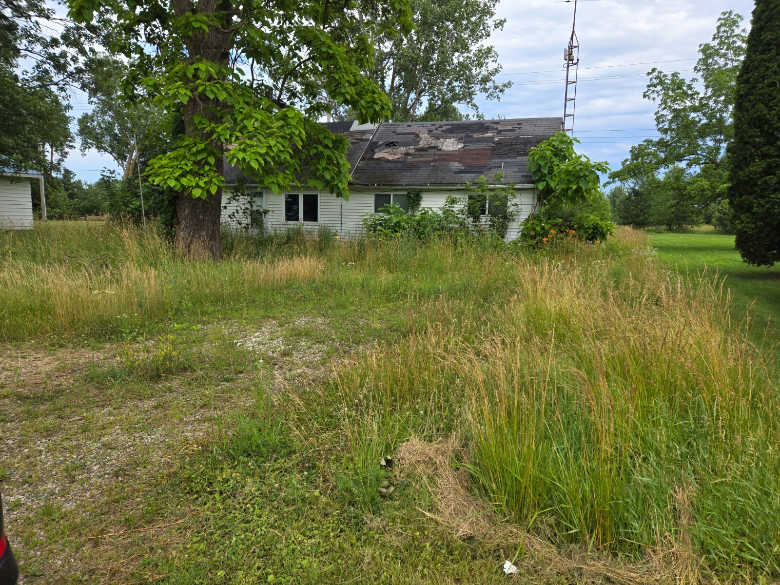 1/2 Acre Prime Lot for Sale – Existing Home Included for Free