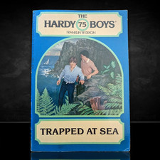 75 Trapped at Sea Hardy Boys Paperback Book 1982 (Round)