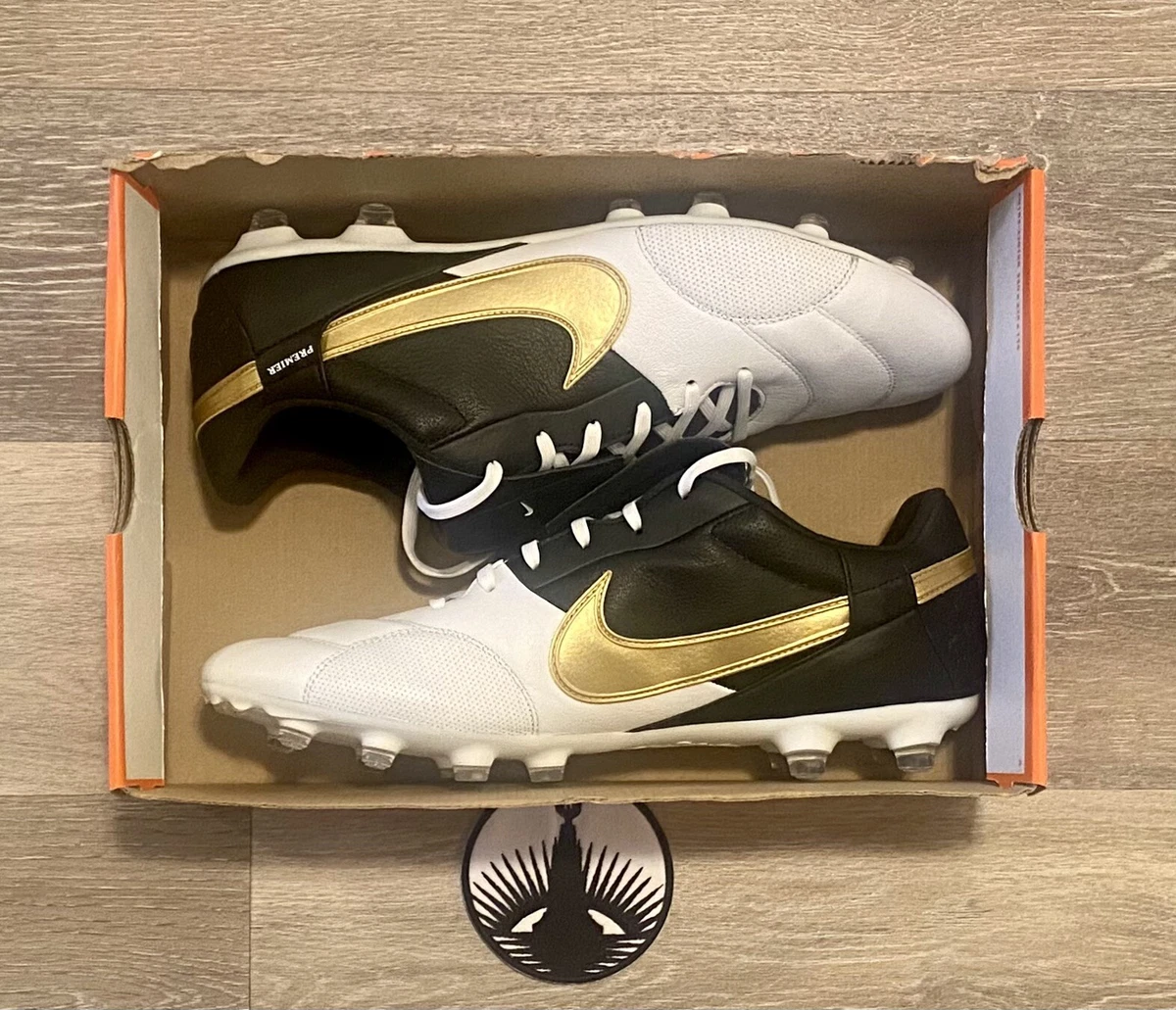 Nike black and shop gold cleats
