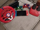 Lot Nintendo Switch OLED bleu fluo/rouge excellent état avec accessoires