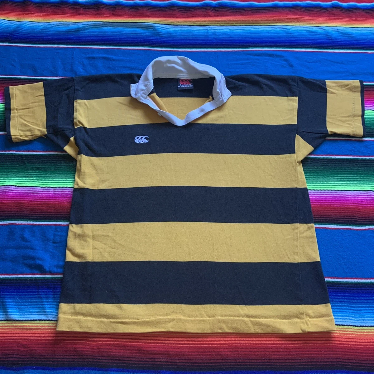 yellow and black striped rugby shirt