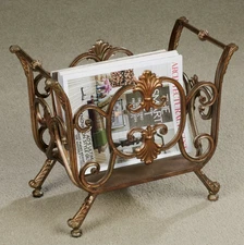 Stratton Magazine Rack is decorated with scrolls and fleurs in an open swirling
