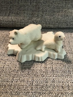 Vintage Polar Bear Cub and a Seal Pup on an Iceberg base.