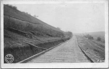 WW1 US Army 310-602 Engineers Postcard Roadway Stockpile RPPC