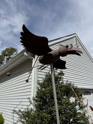 Metal flying bird with glasses, only bird