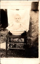 RPPC Postcard Photograph Infant Child in Washbowl on Chair c.1918-1930     23119