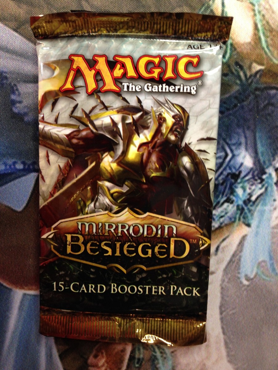 Magic "Mirrodin Besieged" 15-Card Sealed Booster Pack X1 Magic "Mirrodin Besieged" 15-Card Sealed Booster Pack X1