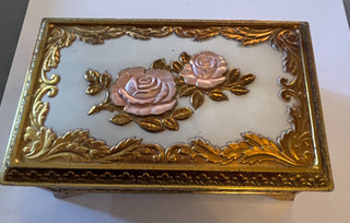 Heavy gold ornate trinket box with floral rose lid and red liner