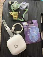 Munchkin Portable UV-C Cleaner Rechargeable Battery with pacifiers