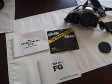 Nikon FG kit with 3 extra lens, filters , tripod, flash, manuals and padded case