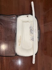 DockATot Deluxe Baby With Toy Arch
