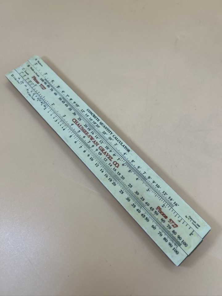 A slide rule made specifically for calculating concrete quantities for a gravel company — a hyper-niche, one-of-a-kind industrial relic with incredible conversation-starter energy.