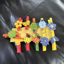 assorted wooden peg clips for hanging artwork or photos