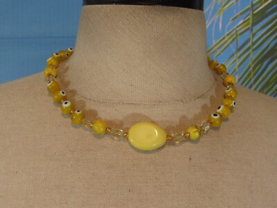 Necklace with a Strand of Multi Styles of Yellow Beads and Gold Beads 18''