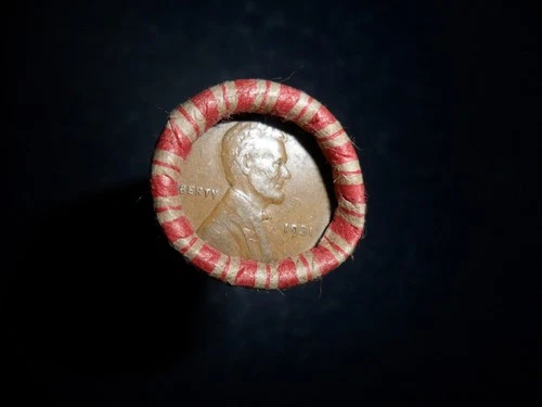 ROLL OF UNSEARCHED WHEAT PENNIES WITH 1931 AND A 1935D PENNY ON THE ENDS.