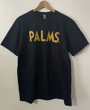 2023 PALMS LAS VEGAS CASINO  RESORT, GOLD LETTER TEE  SIZE LARGE & HAND TOWEL