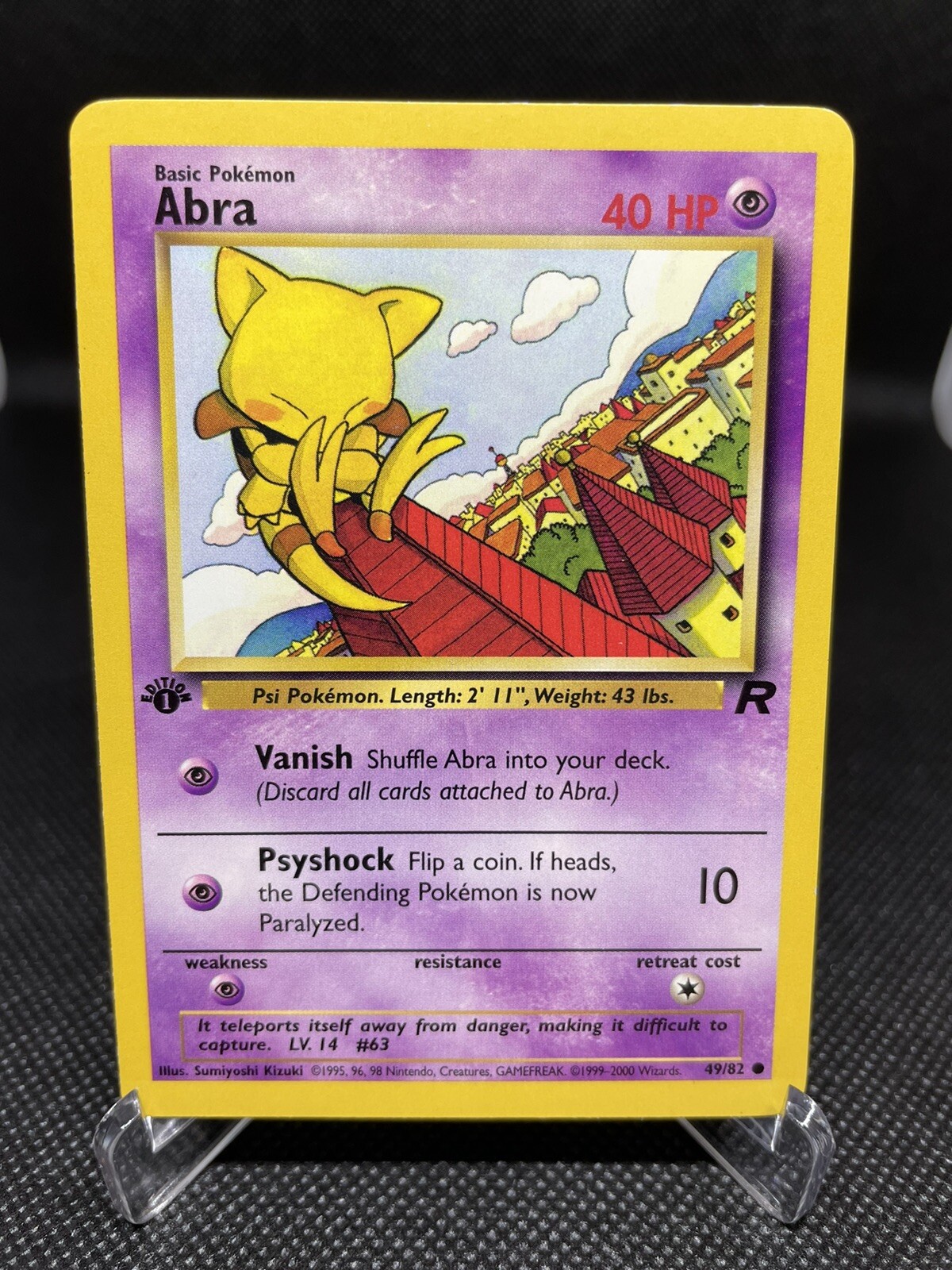 1st Edition Team Rocket Abra 49/82 Pokemon Card- Near Mint (NM)