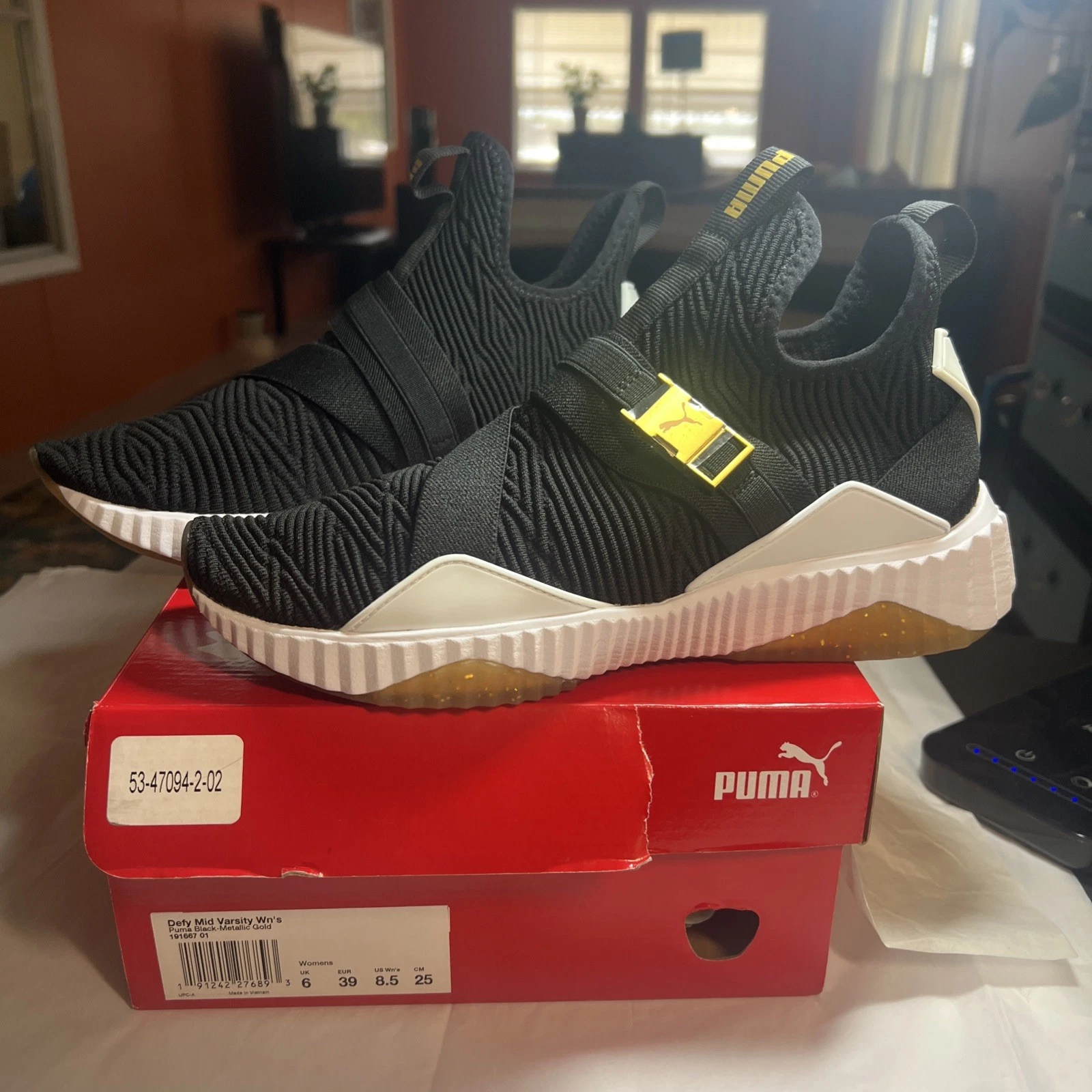 Scarpe da ginnastica Puma Defy Mid Varsity slip on donna nero bianco e oro 8 1 2