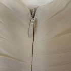 Silver zipper with chain detail on ivory silk wedding dress made in USA, shown on close-up of textured bodice.
