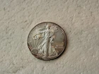 2012 AMERICAN EAGLE 1 OZ FINE SILVER DOLLAR - UNC (SOME PINK COLORING)