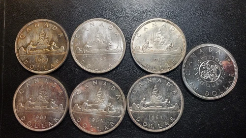 LOT OF SEVEN 80% CANADIAN SILVER DOLLAR.  MIX OF UNC AND PROOF