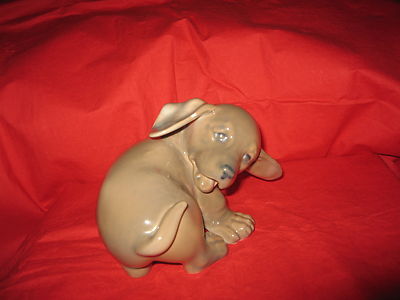 Royal Copenhagen Porcelain Figurine  Dachshund Puppy Chasing its Tail    1407