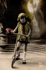 VINTAGE postcard:   LITTLE GIRL ON A SCOOTER