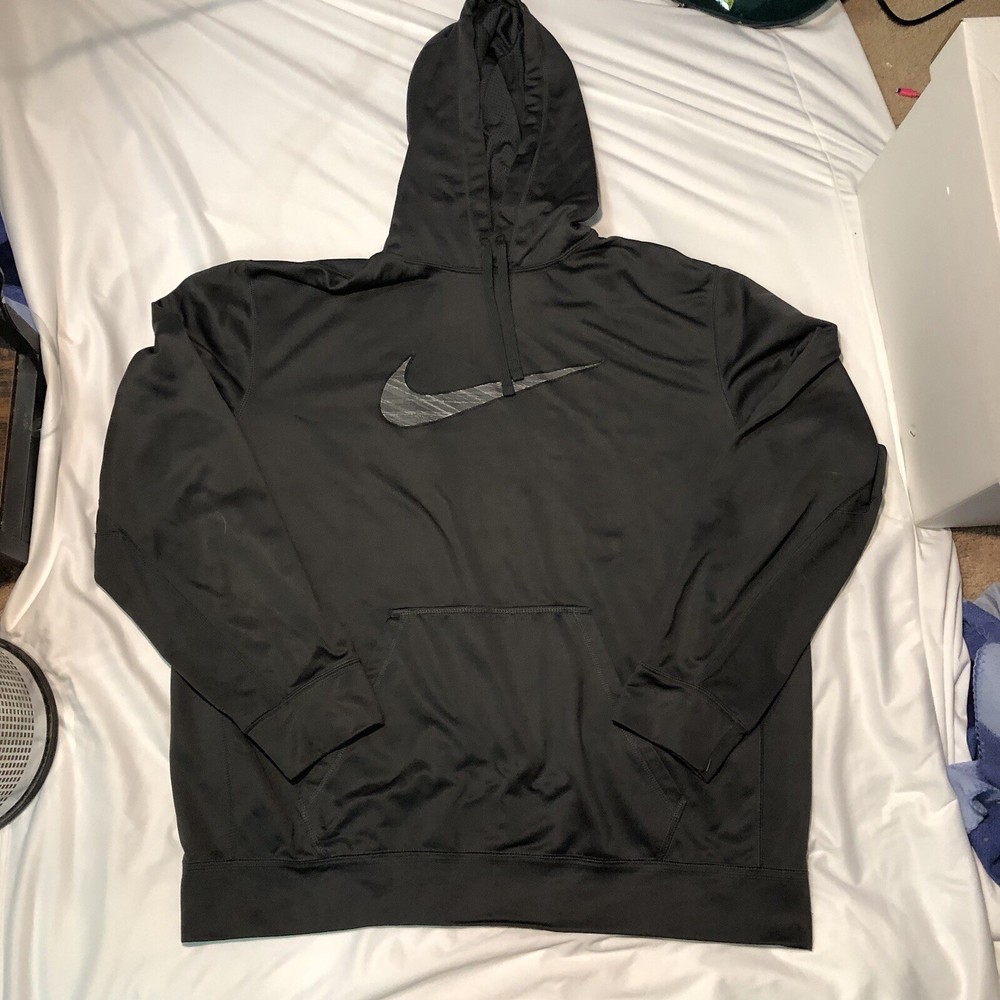 Stay warm in a Black Nike Therma-Fit hoodie featuring a sleek grey logo
