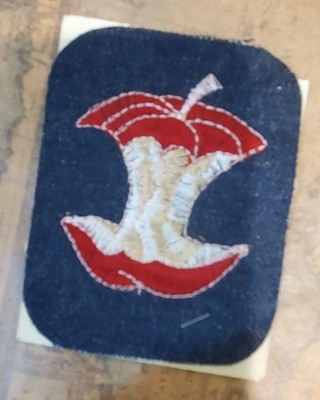 SINGER embroidered iron on patch of apple core on dark wash blue denim - 4'' x 3''